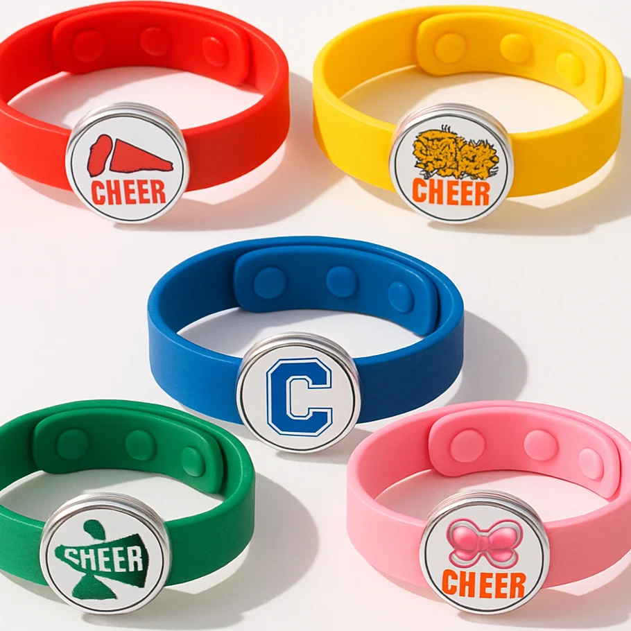 Group of matching cheer team bracelets in coordinated snap-button